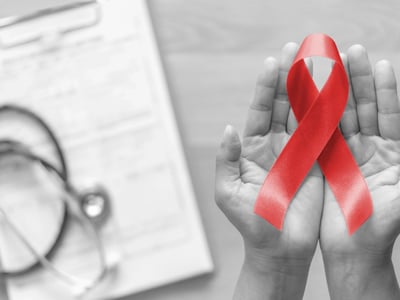 Rote Schleife (Red Ribbon) als Zeichen für Solidarität mit HIV-Infizierten.